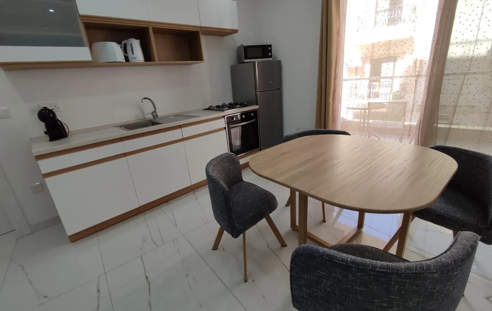 Апартаменты Il-Girna- Modern Seaside Accommodation Марсаскала